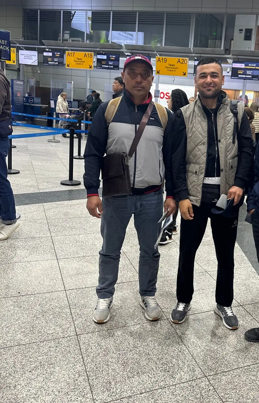 Two travelers ready for their transfer at the airport